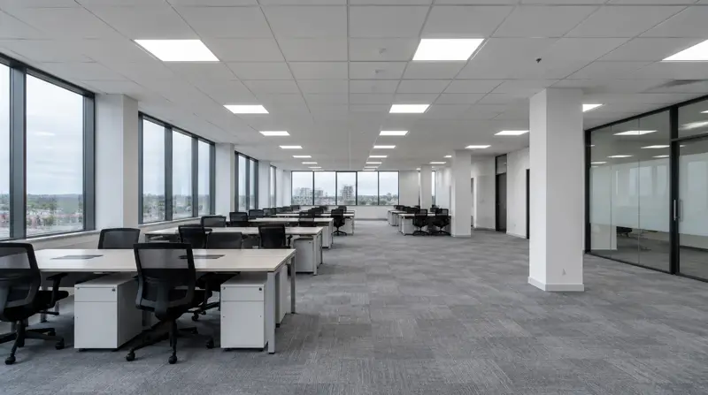 Open-plan office with a new white suspended ceiling and LED panels